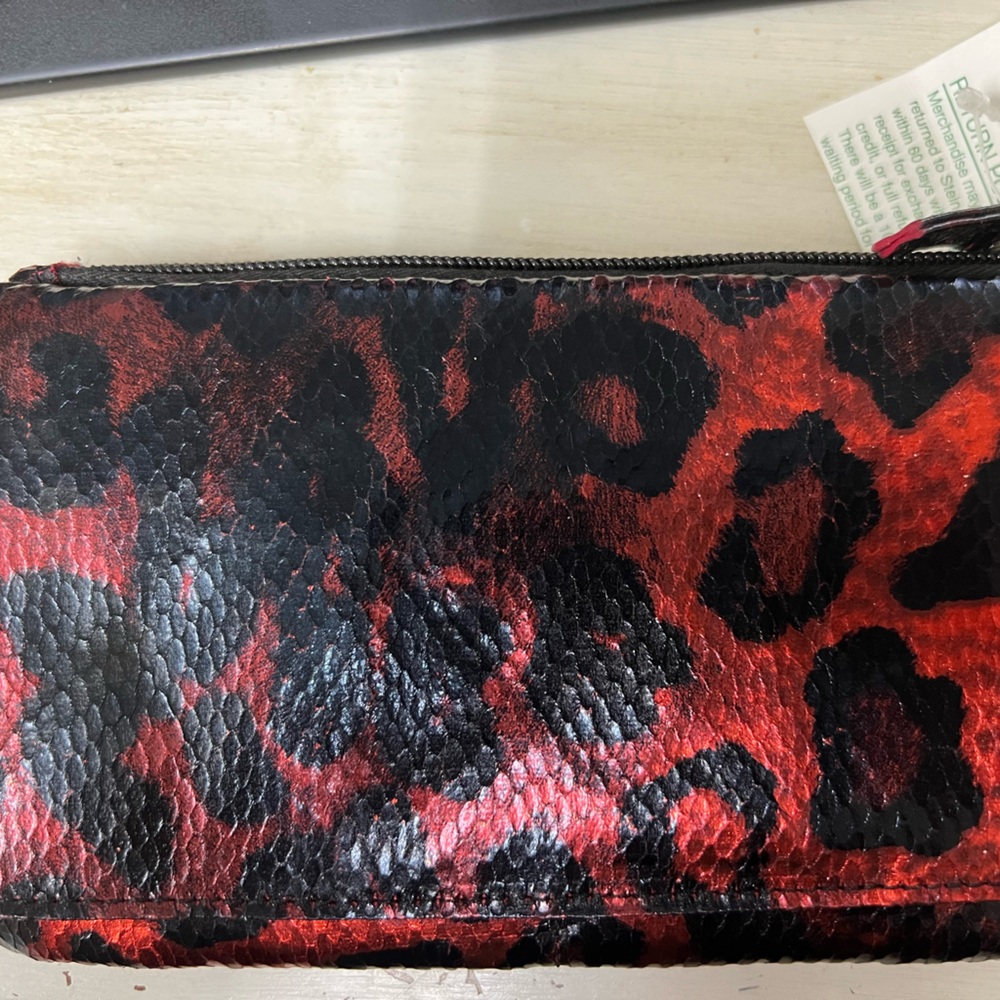 NWT Rolfs reddish/orange and black leopard print wallet.